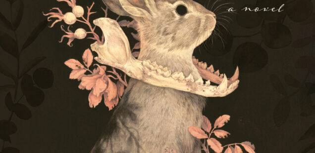 Book cover for The Witch of Willow Sound a novel by Vanessa F. Penney with a picture of a rabbit sitting up in a clump of flowers with a predator's jaw bone around it's neck